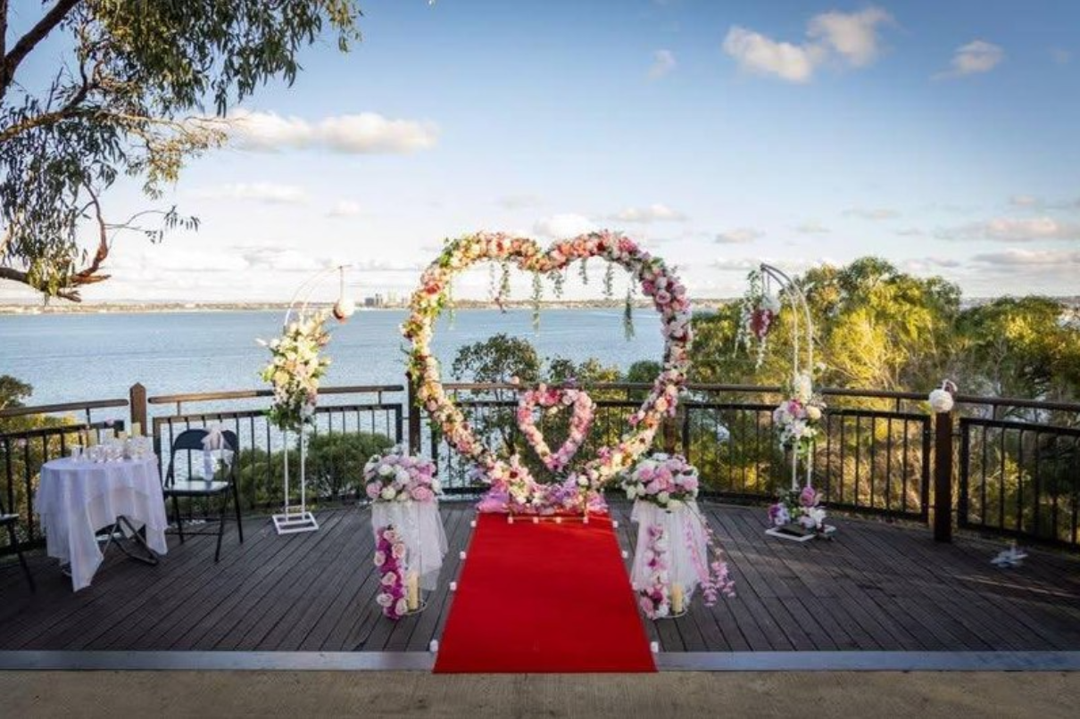 Heart-shaped floral arch overlooking the river